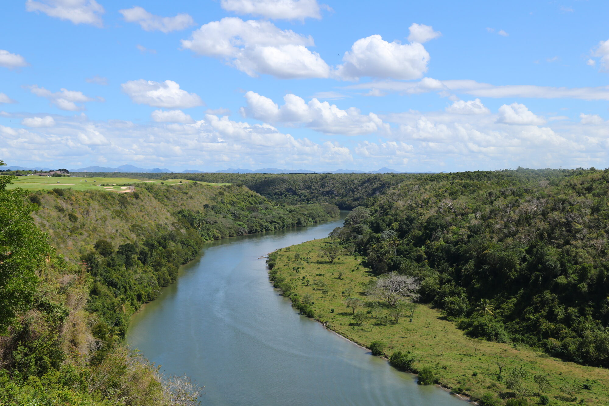 The Chavón River winding through green forest