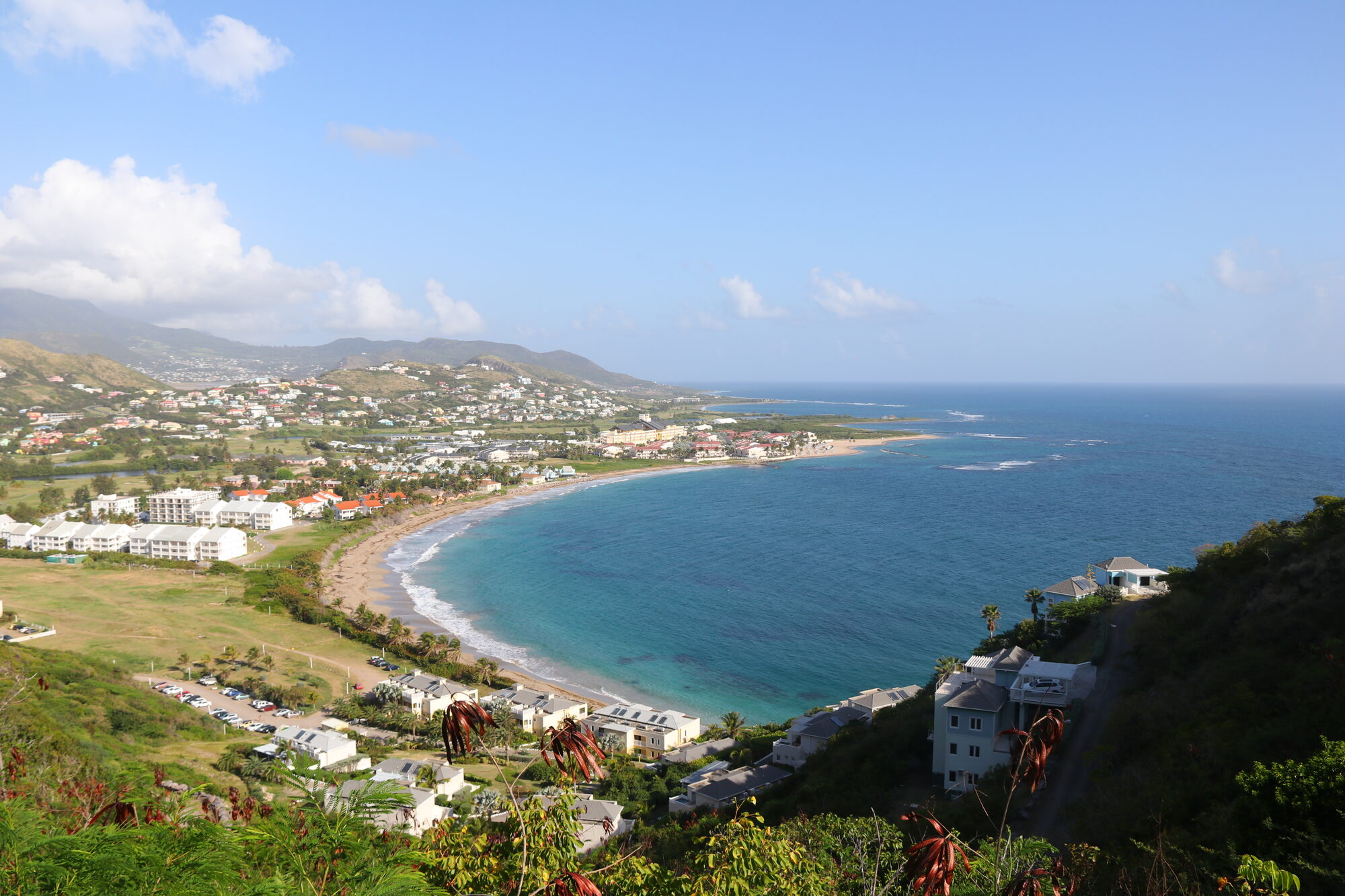 Frigate Bay curving between green hills and the sea