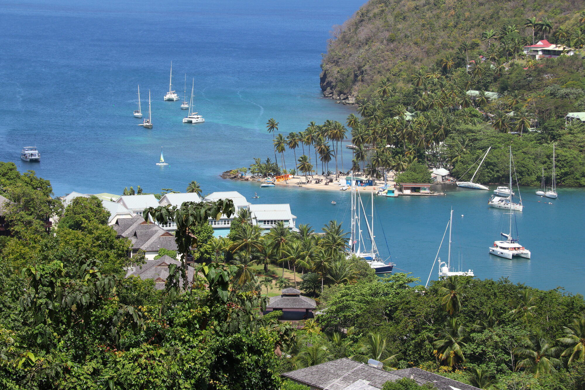 Marigot Bay with yachts among green hills